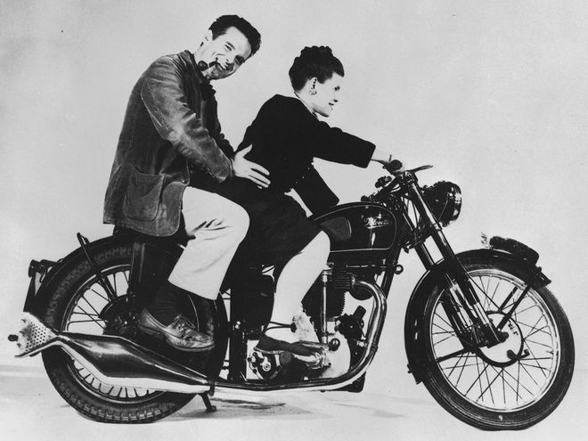 Charles and Ray Eames on a motorcycle
