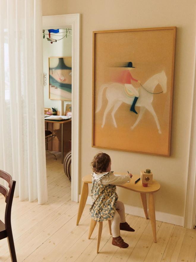 A child playing at Ferm Living's Feve kids desk