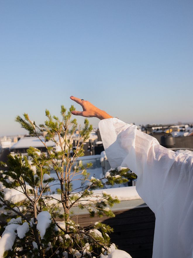 A hand pointing to the sky