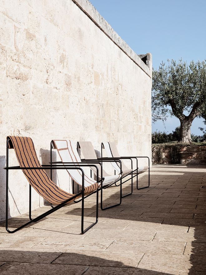 Ferm Living's Desert Lounge chairs outside.