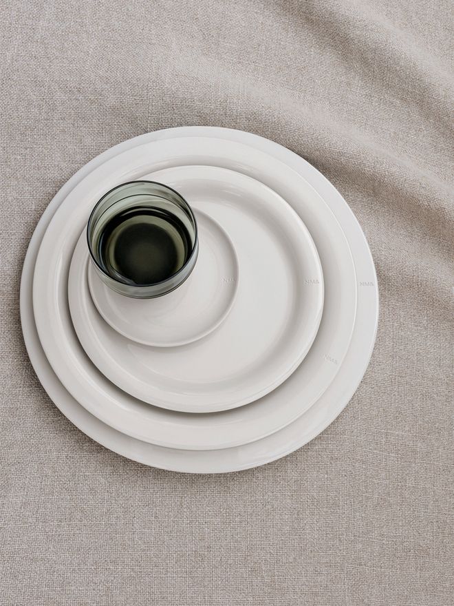 Design House Stockholm's Sand plates on a linen tablecloth