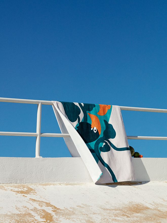 An image of a beach towel with Marimekko's Pepe print.