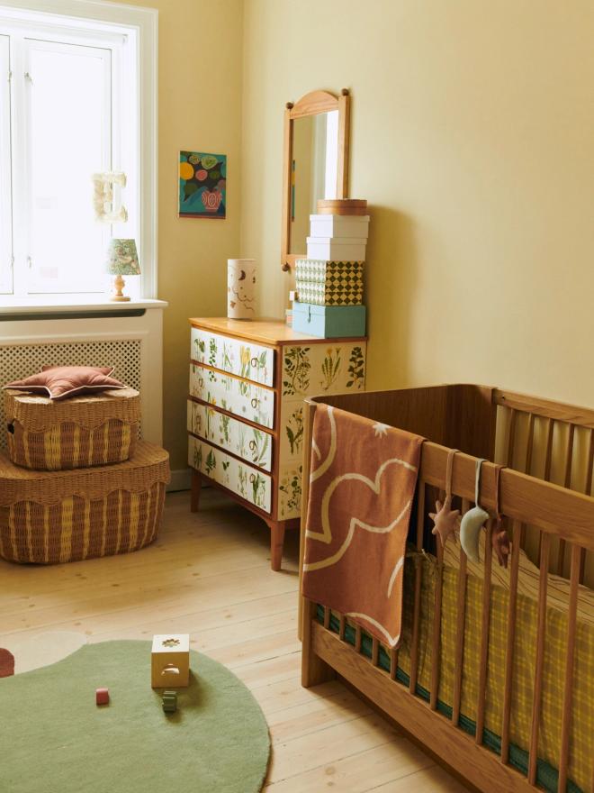 Ferm Living's Tilu baby cot in natural oak
