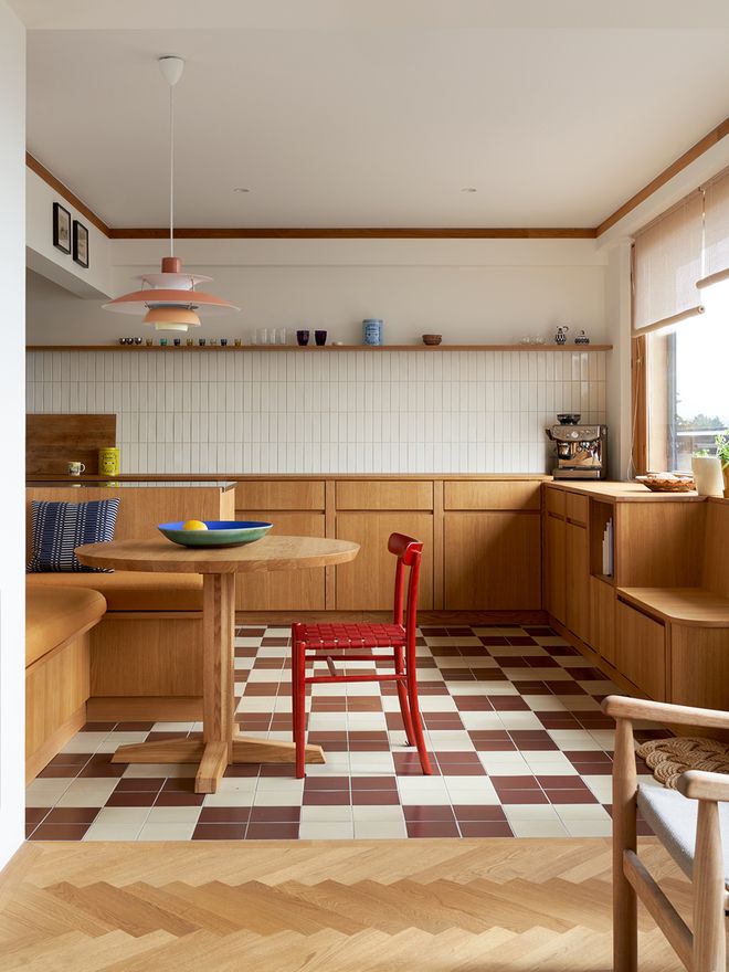 A kitchen with ceramic tiles on the floor