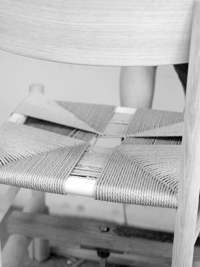 Black-and-white photo of creating of J39 chair