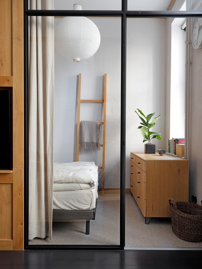A bedroom with a glass door