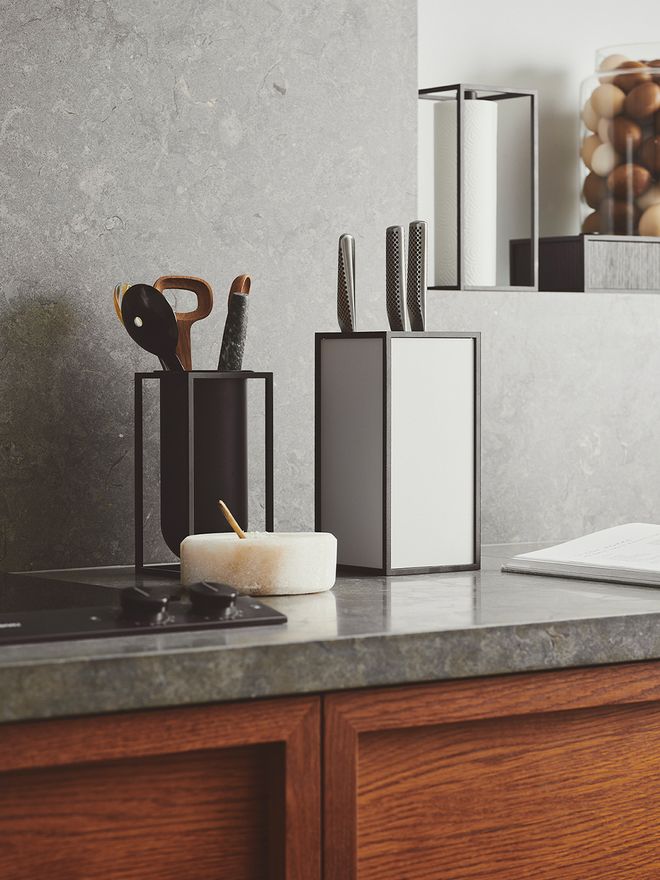 An image featuring by Lassen's Kubus Roll'in kitchen paper holder and K'block knife holder as part of the kitchen decor.