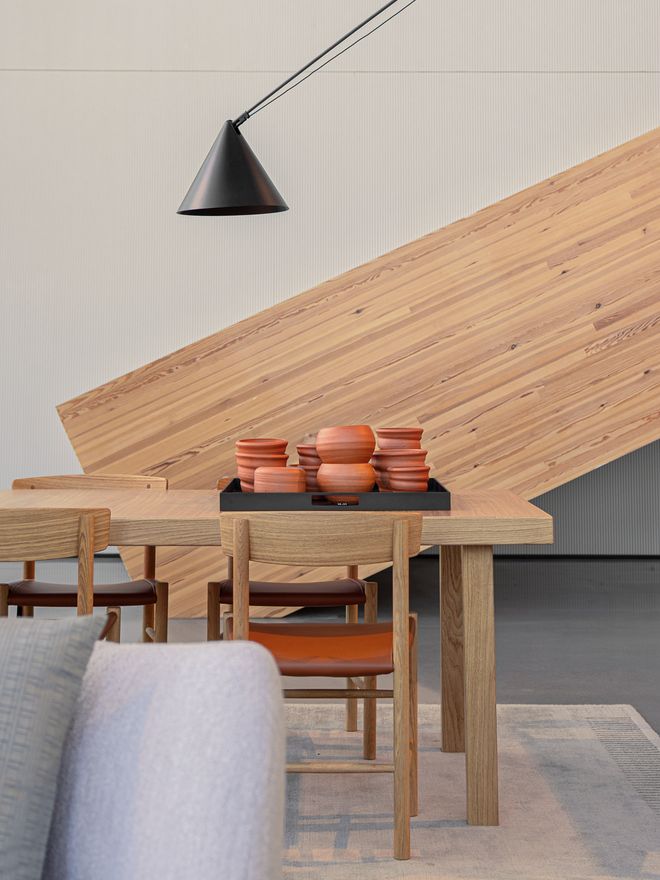 Udumbara terracotta pots on a dining table made of oak