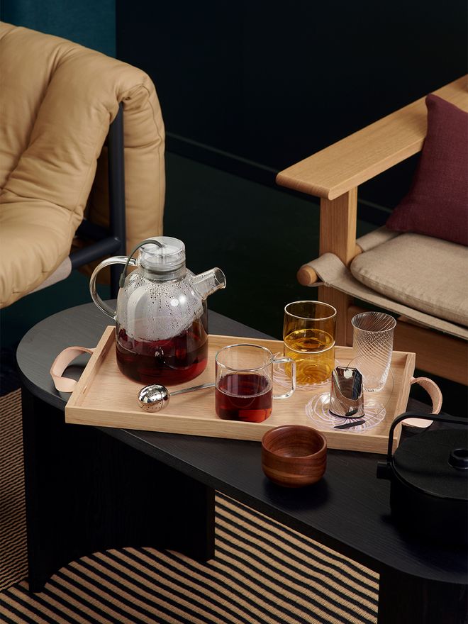 An image of Made by Choice's black Airisto bench as a coffee table, as part of the living room decor.