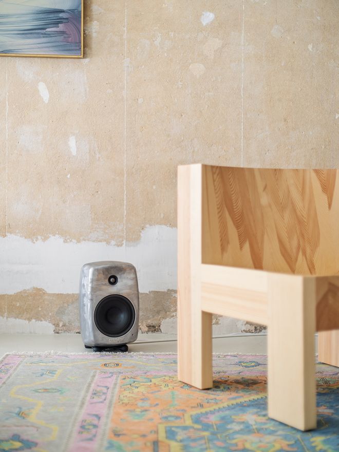 A close-up of the Vaarnii 005 lounge chair, showing the natural grain of the pine