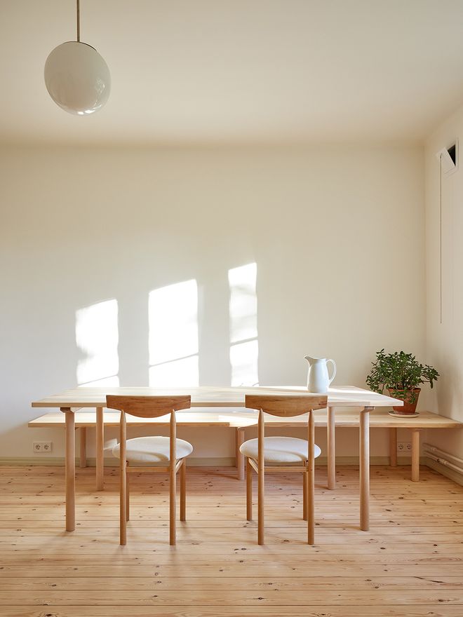 A wooden table and bench in the kitchen
