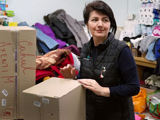 A volunteer packing supplies