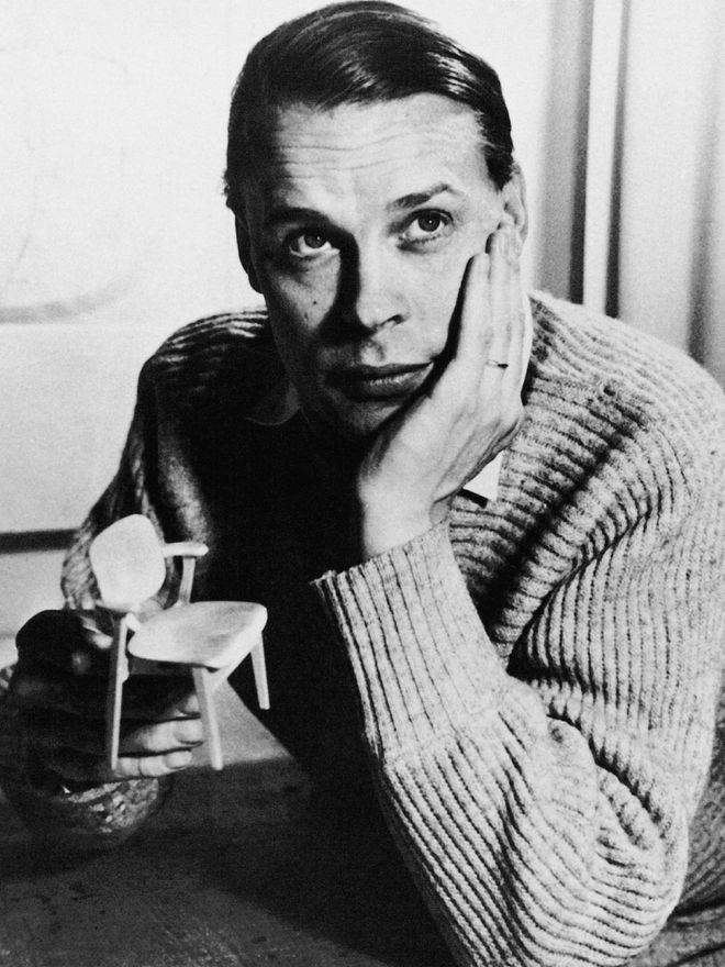 Ilmari Tapiovaara with a scale model of the Domus chair