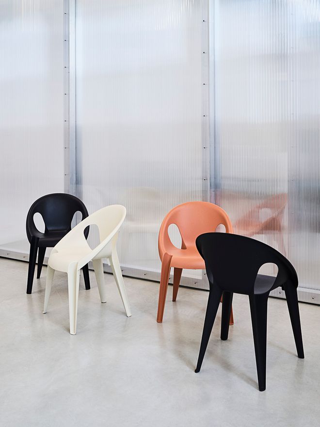 Four different coloured Bell chairs