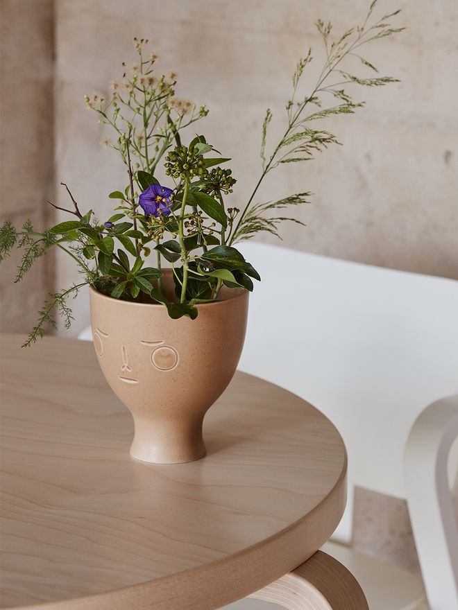 An image of Artek's Midsummer Dream vase filled with flowers.