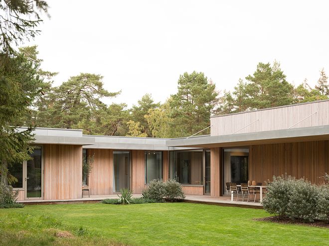 An image of Villa MSV, a private home located in Sweden. The image features the façade and the terrace of Villa MSV.