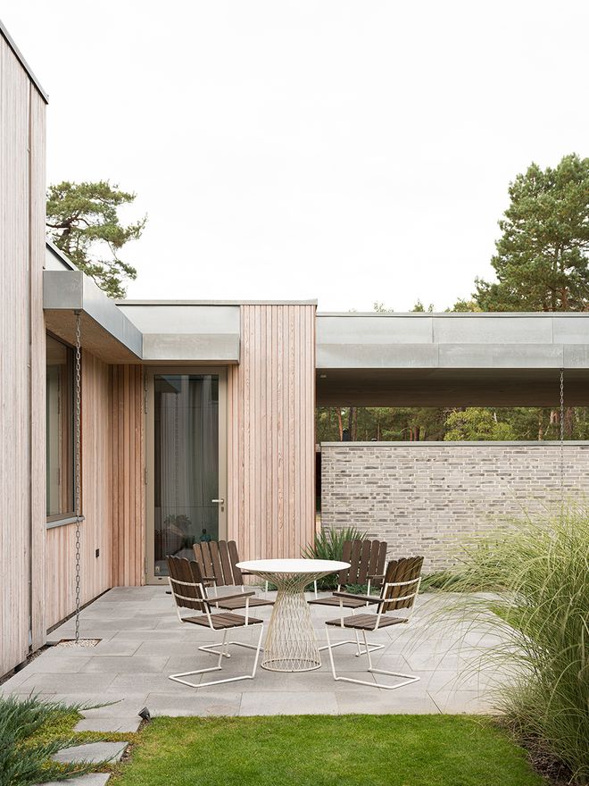 An image of Villa MSV, a private home located in Sweden. The image features the façade and the terrace of Villa MSV.