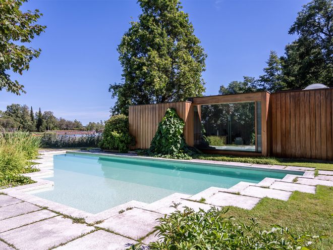 An image featuring Villa Ervi designed by architect Aarne Ervi. The photo shows the pool and the exterior of the office building.
