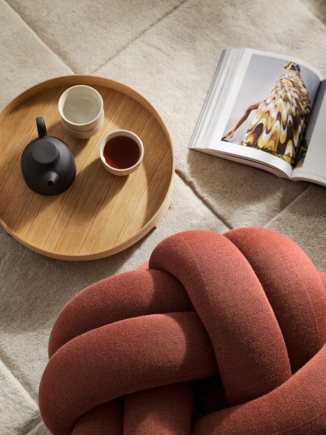 An image featuring Design House Stockholm's Knot cushion as part of the living room decor.