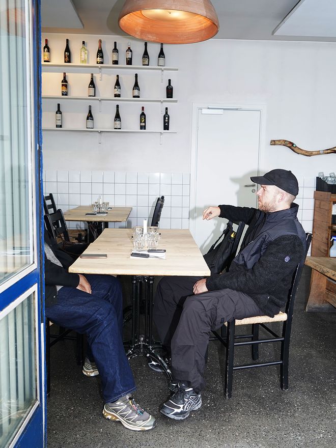 Simon Legald with his friend at a restaurant