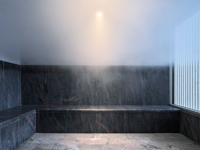 An image of Andrum spa's interior: stone benches in the stteam room.