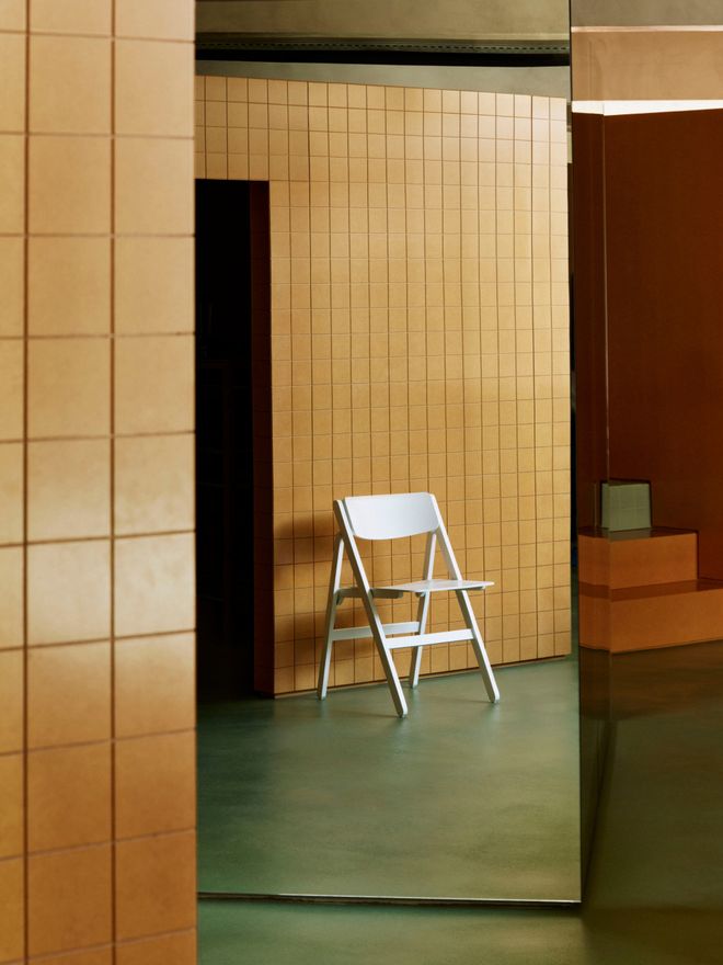 HAY's Backflip folding chair with a beech veneer seat and a solid wood frame