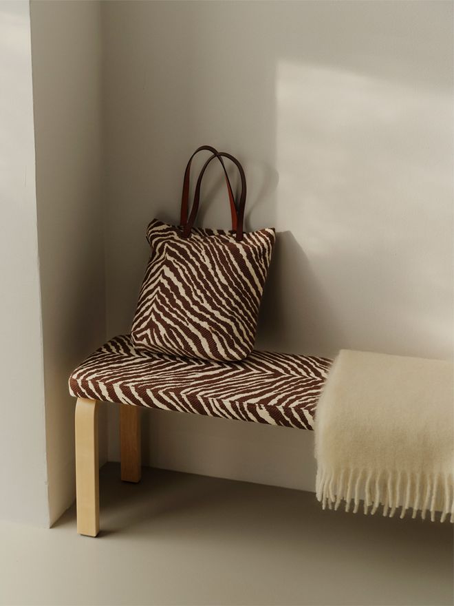 An Artek bench and bag in Zebra fabric