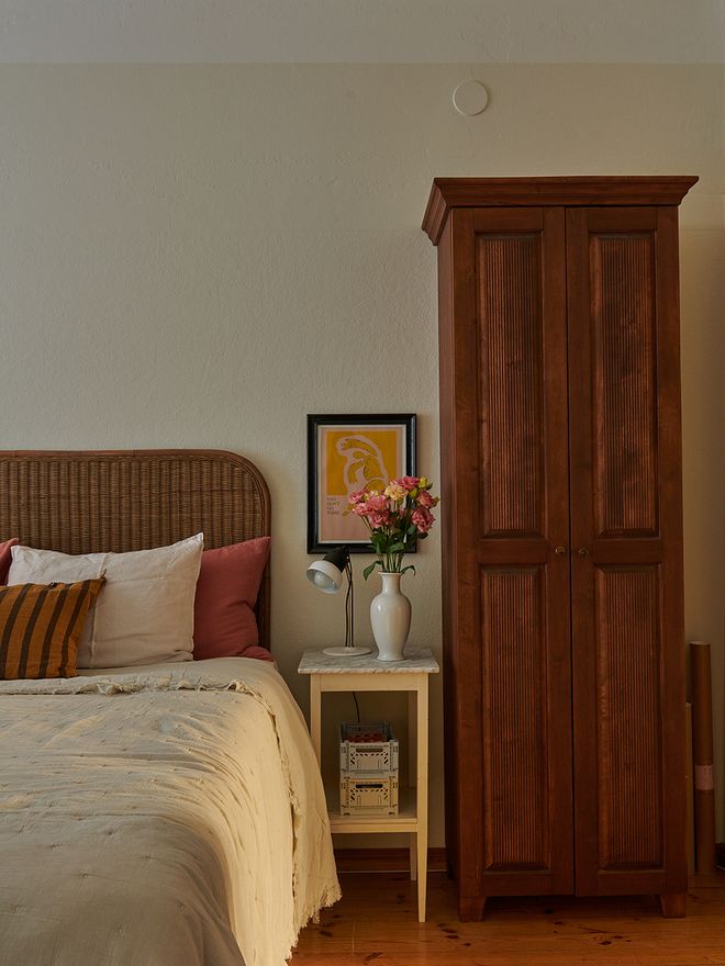An old wooden cabinet in a bedroom