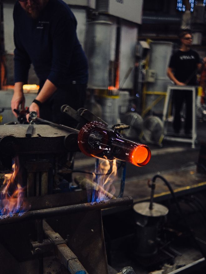 Solare vases being made at the Iittala Glass Factory: molten glass heated with a flame