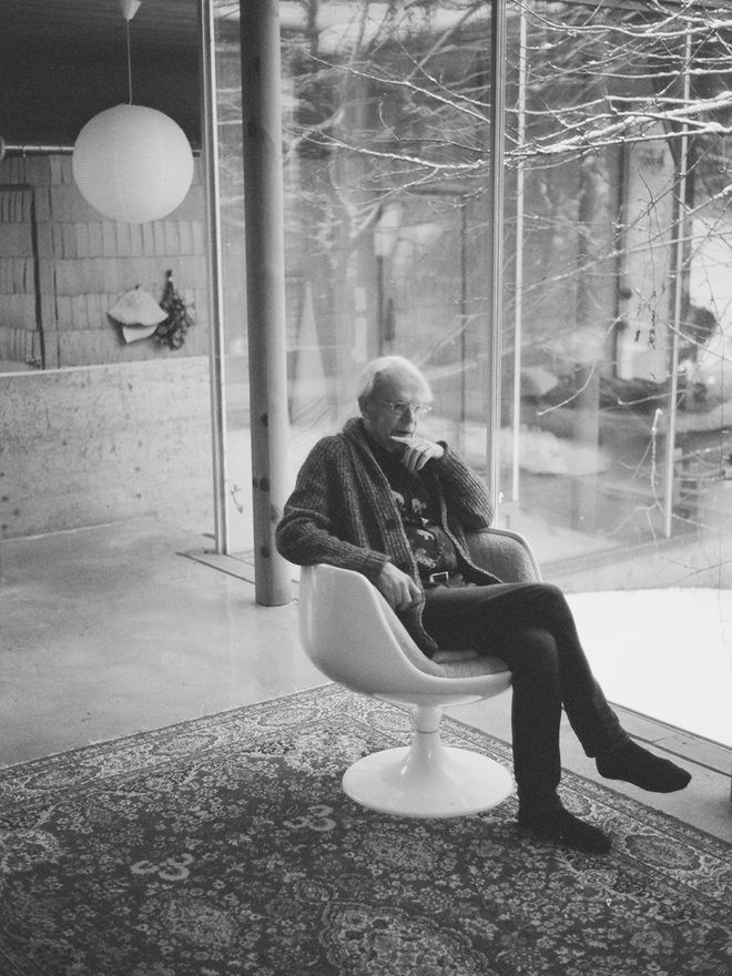Olavi Koponen sitting in a living room