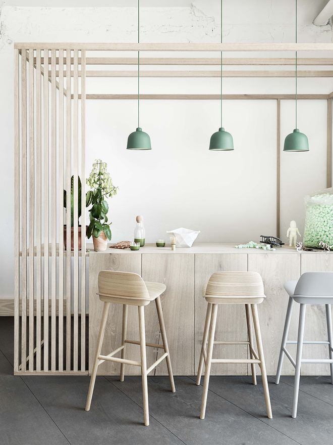Muuto's Nerd bar stools next to a kitchen counter.