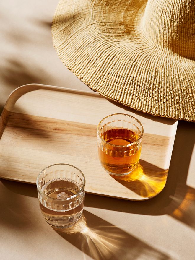 Iittala's Raami tumblers on a wooden tray.