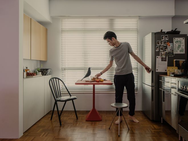 Lam Jun Nan cooking in his home