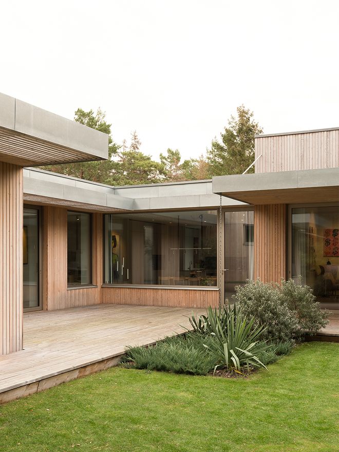 An image of Villa MSV, a private home located in Sweden. The image features the façade and the terrace of Villa MSV.
