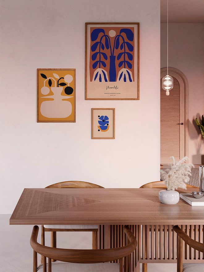 An image of Berenice Hernandez's Jarrón poster and Flor Azul poster hung on the wall.