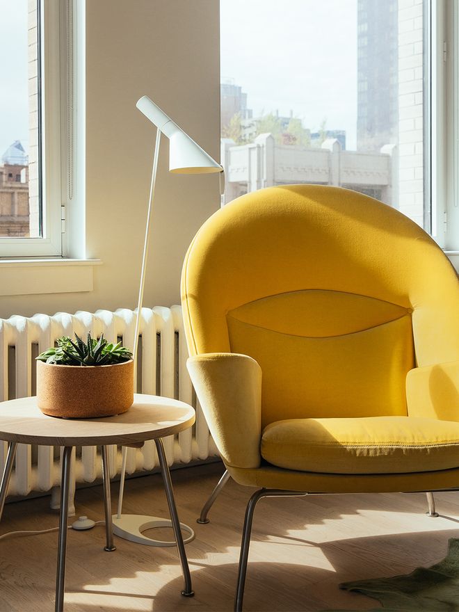 Louis Poulsen's AJ floor lamp in living room decor.