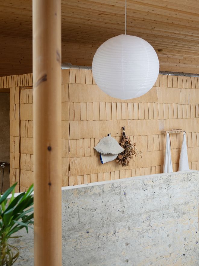 A shower room clad with aspen shingle