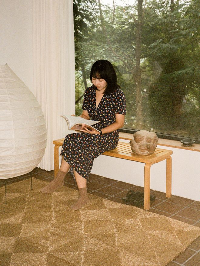 A portrait of a woman browsing a book