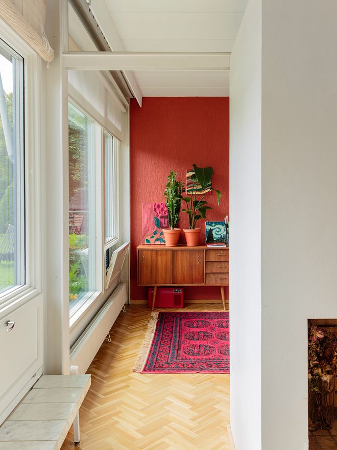 A wide doorway and a sliding door between the rooms
