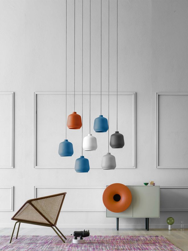 Different-coloured Kiki luminaires hanging on the room