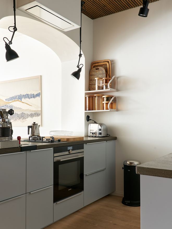 A grey-colored kitchen cabinets