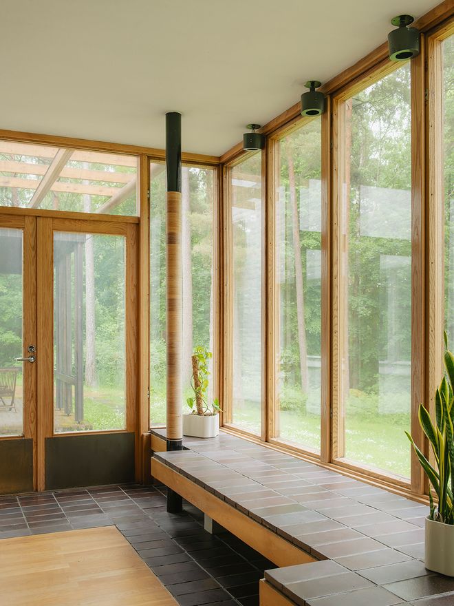 The ground floor living area and large windows at Kantola in Sunila