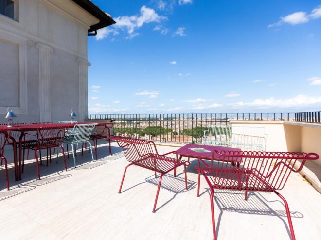 South outdoor furniture in red by Magis on the rooftop terrace