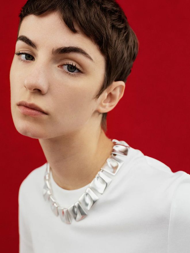 Model wearing the Planetary Valleys necklace in silver.