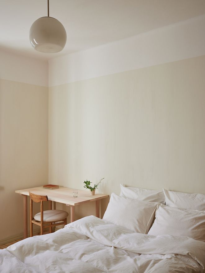 A bed and a desk next to it
