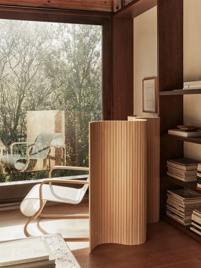 Artek’s room divider made from undulating wooden slats, designed by Alvar Aalto in 1936