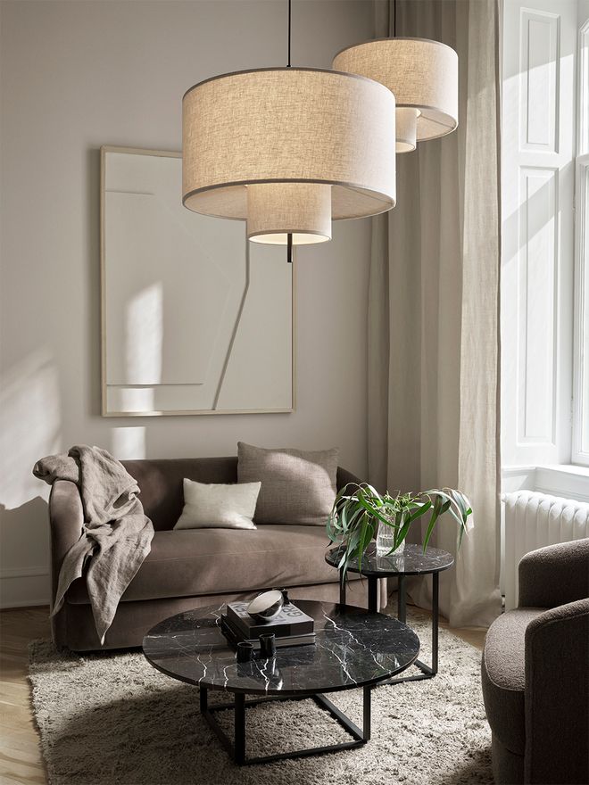 New Works' Margin pendant lights in a living room.