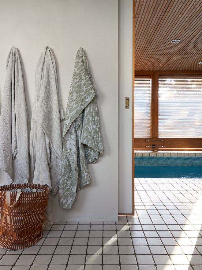 Towels hanging and an indoor pool