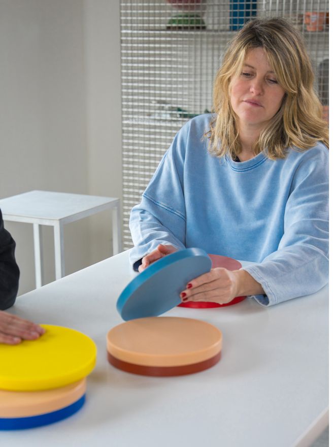 Fien Muller presenting colourful Circle trays