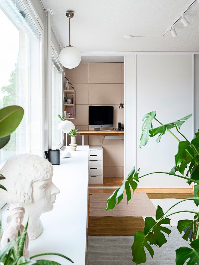 Home office hidden behind the white sliding doors